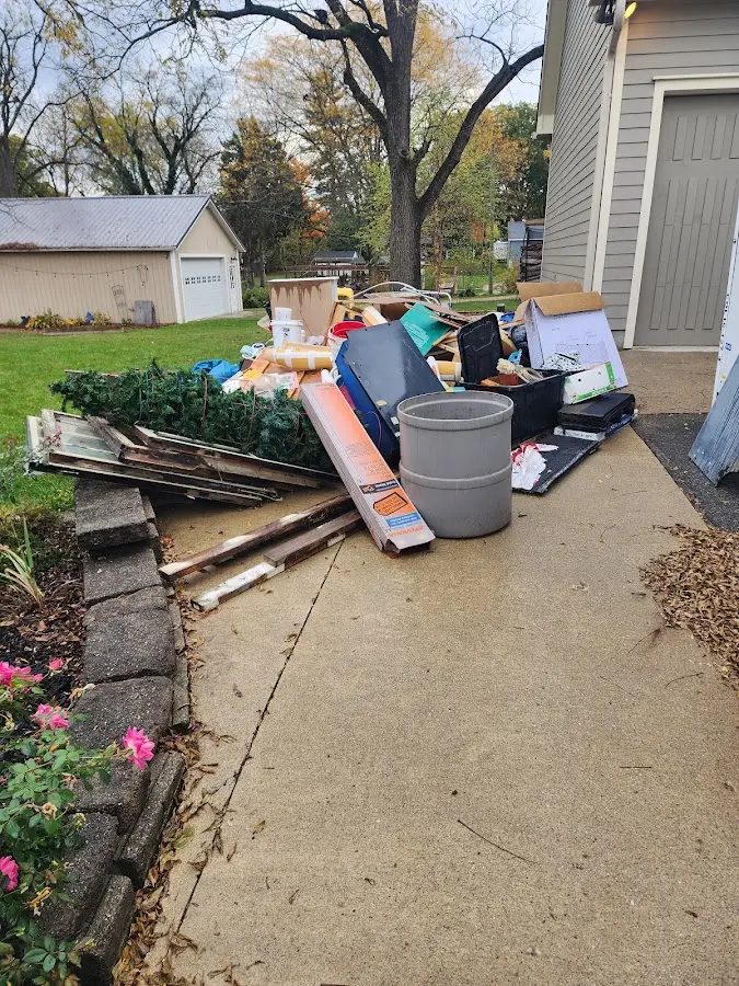 Dumpster being loaded with debris for Demolition Dumpster Rental in South Valley